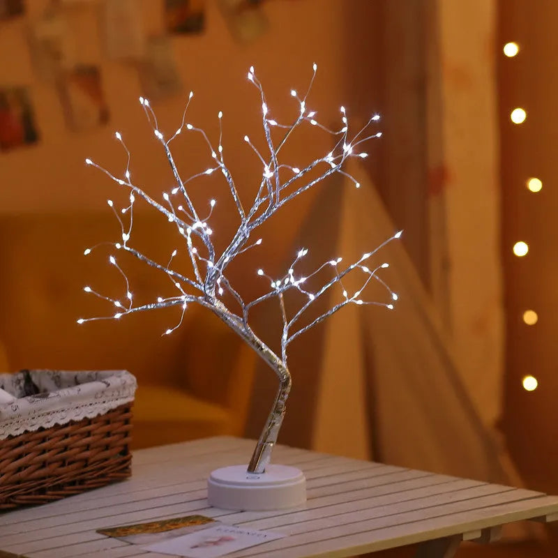 White LED Christmas tree shaped night light with touch base, standing 50cm tall on a table.