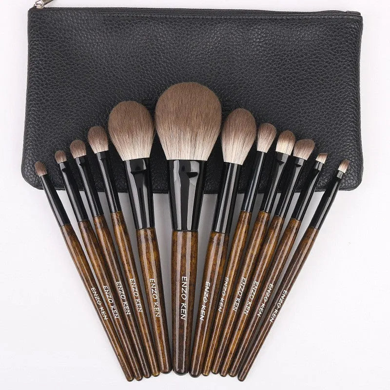 12-piece makeup brush set with wooden handles in a black PU carrying case, including a powder foundation brush.