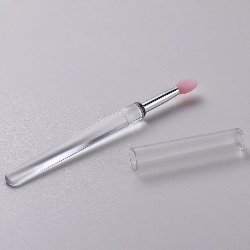 Set of silicone lip brushes with caps in various colours including blue, pink, and purple.