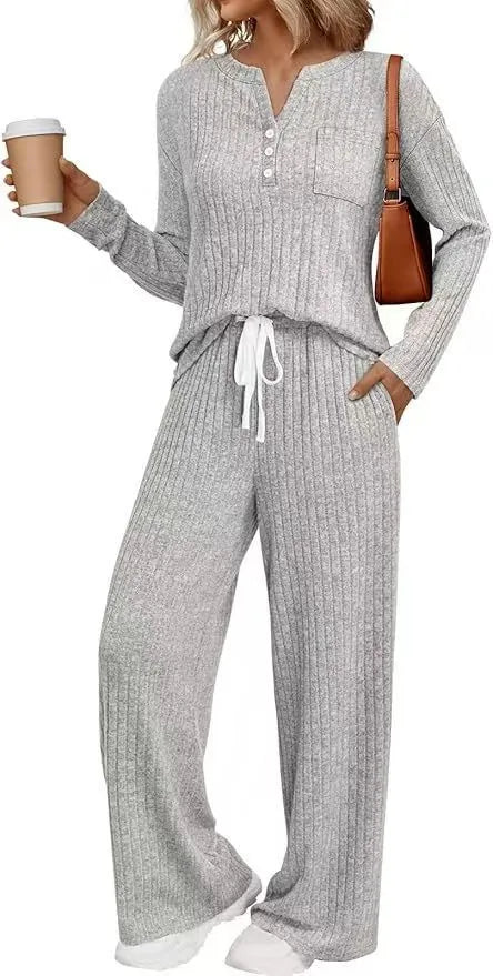 Women's striped knit V-neck long coat in light grey with matching pants, showing lace-up details