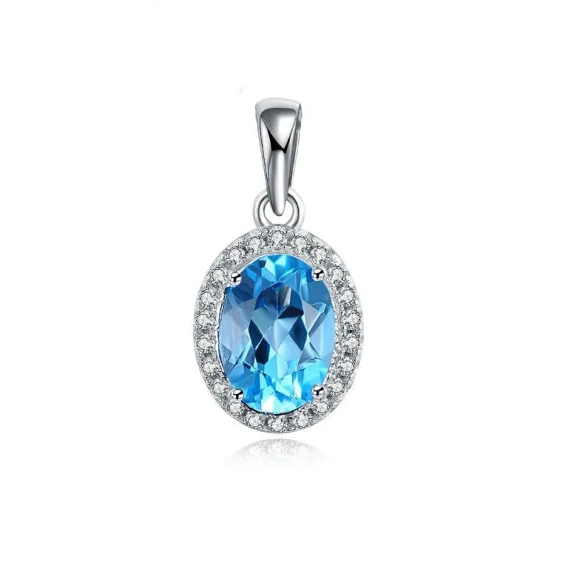 Women's 925 sterling silver jewellery set with blue topaz gemstones showing earrings, ring, pendant, and necklace with geometric pattern