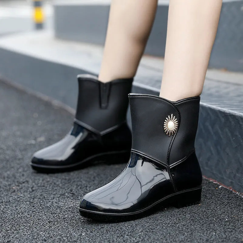 Women's purple PVC rain boots with non-slip sole and middle tube design