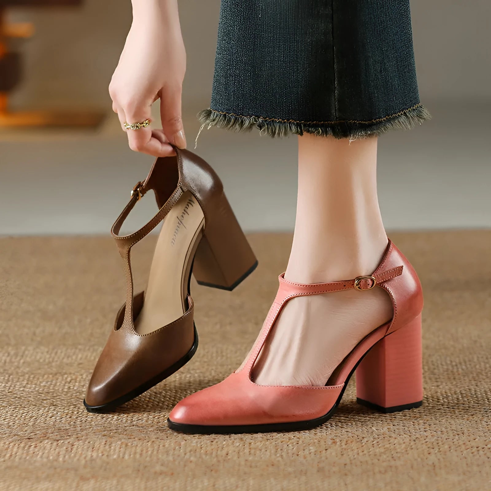 Retro pointed-toe women's Mary Jane shoes with a hollow design and buckle strap in pink or dark brown.
