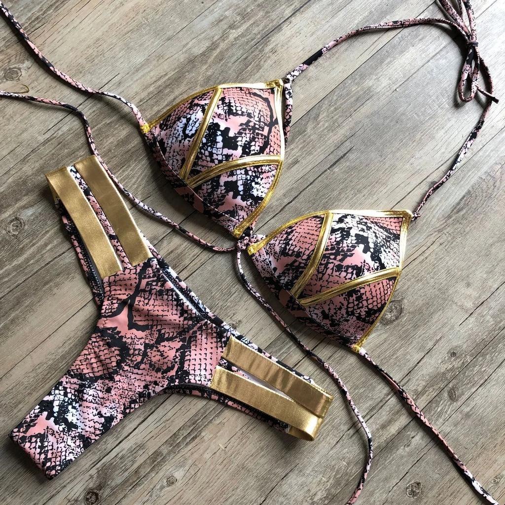 Women's bronzing bikini swimsuit with removable pads and cotton lining on a mannequin.