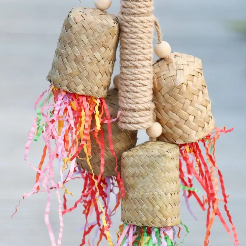 Colourful shredded paper bird toy with wood pieces and sisal fibres for parrots