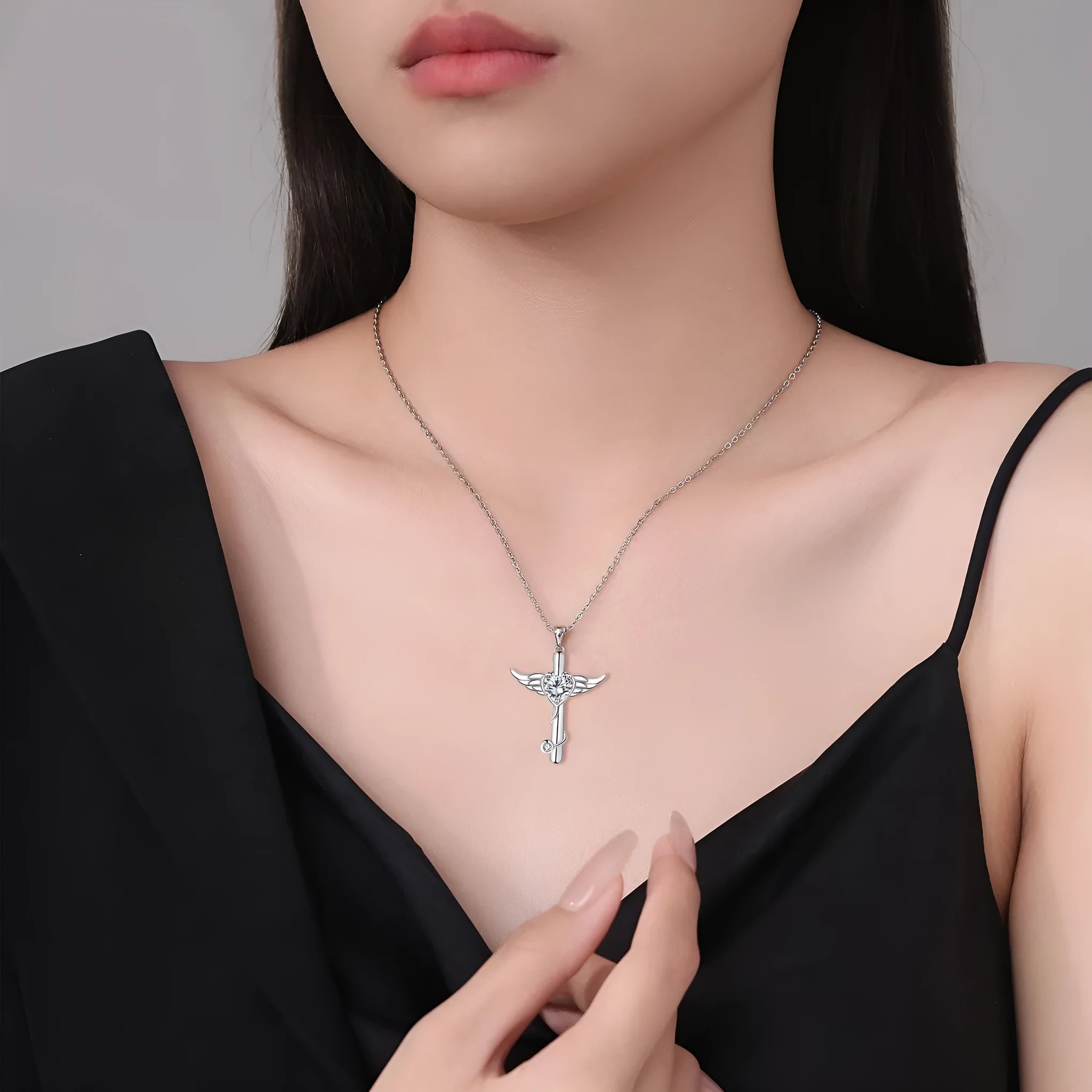 Sterling silver electroplated cross stethoscope necklace with wing design pendant and diamond crystals