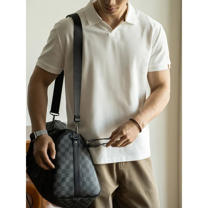 Blue short-sleeved cotton blend polo shirt for men on a hanger, showing regular fit and button placket.