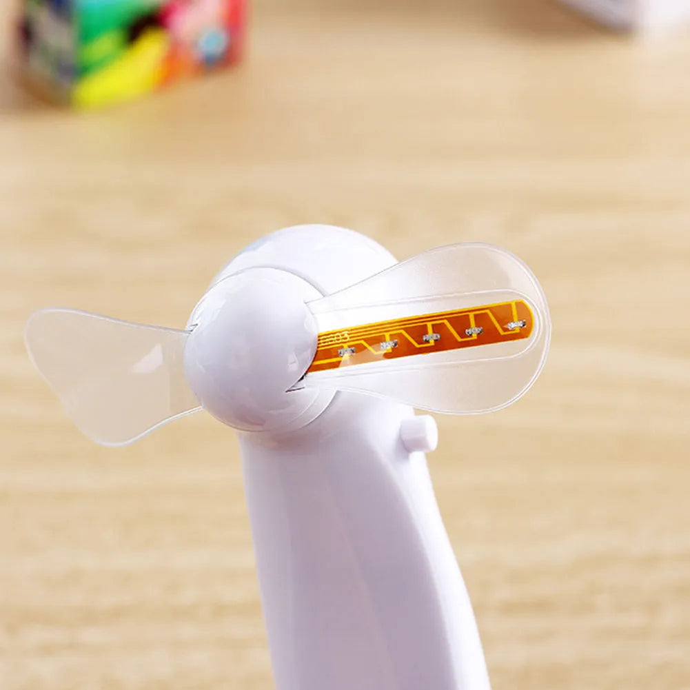 White handheld mini fan with flashing blue and red 'I Love You' LED display