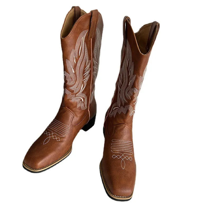 Brown women's mid-calf Martin boots with embroidered pattern, leather lining, and a square rubber sole.