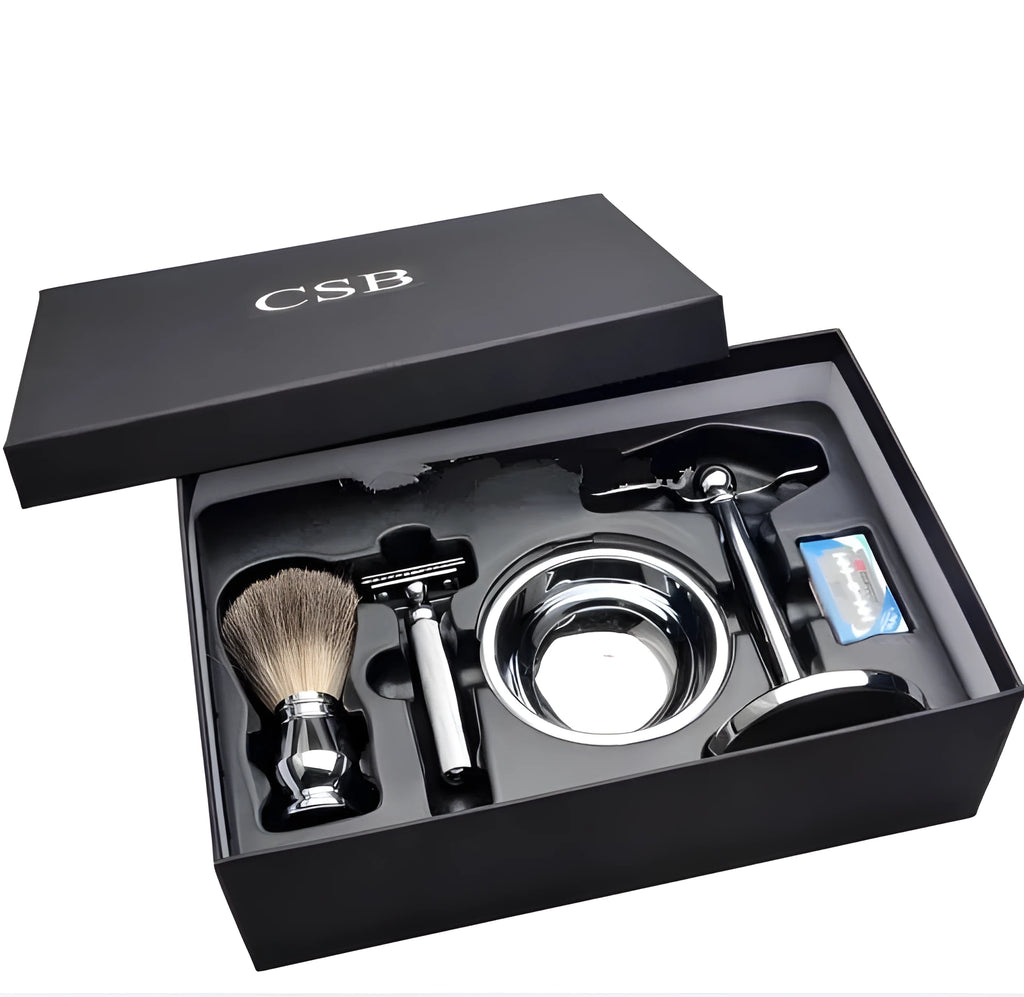 CSB men's shaving kit with chrome razor and stand, badger hair brush, soap bowl, and blades on black box.
