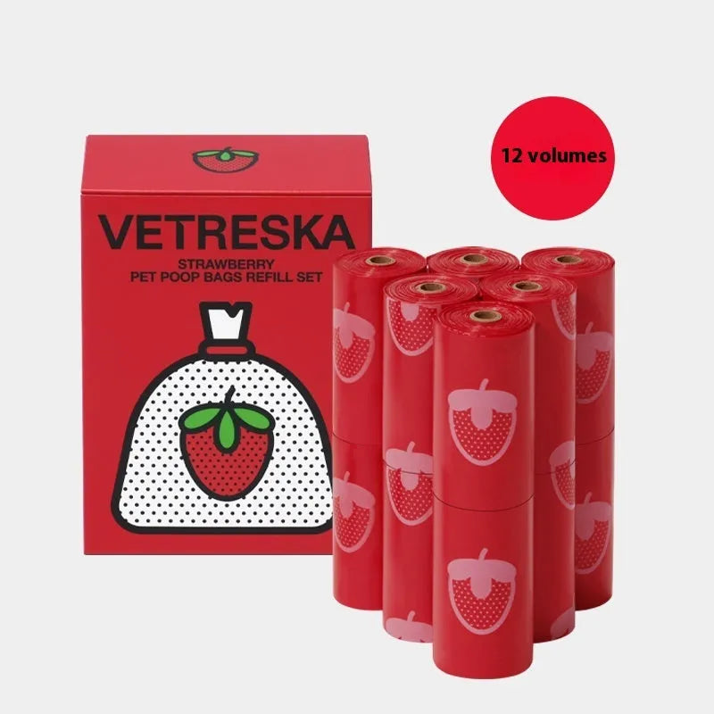 Portable dog poo bag dispenser capsule with strawberry design and a roll of scented biodegradable bags.