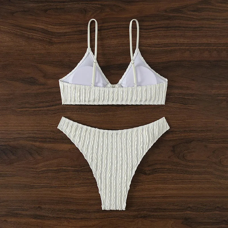 White women's V-neck swimsuit set with matching shorts for swimming