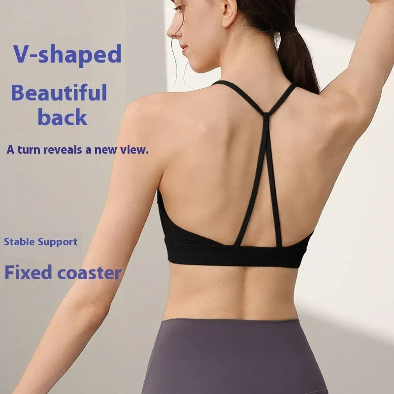 Women's black nylon sports vest with double shoulder straps for running and gym workouts.