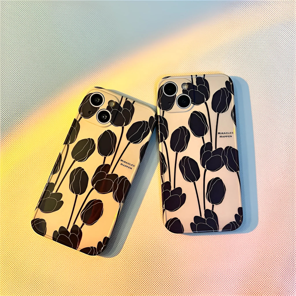Black silicone iPhone case with a detailed tulip flower print on the back.