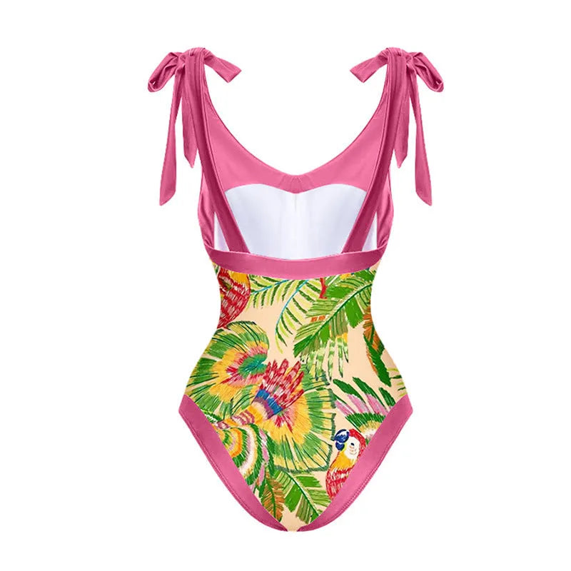 Women's pink floral print one-piece swimsuit with V-neck and a separate cover-up skirt.