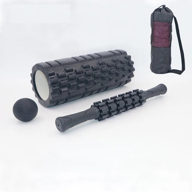 Black foam massage roller stick with six textured sections measuring 33cm long