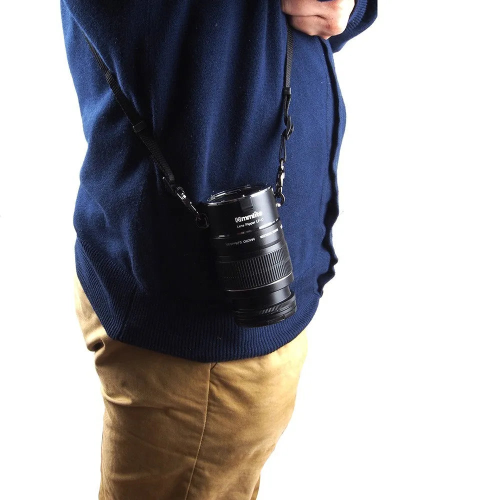Aluminium alloy Nikon E-Mount lens flipper with stainless steel buckle and cotton shoulder strap.