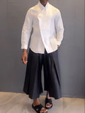 Women's white asymmetric front long sleeve shirt and black pleated trousers casual set
