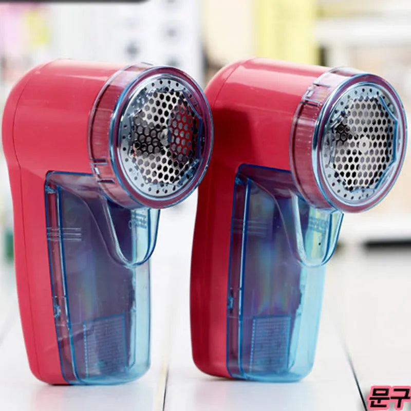 Portable electric lint remover for clothing on a white background
