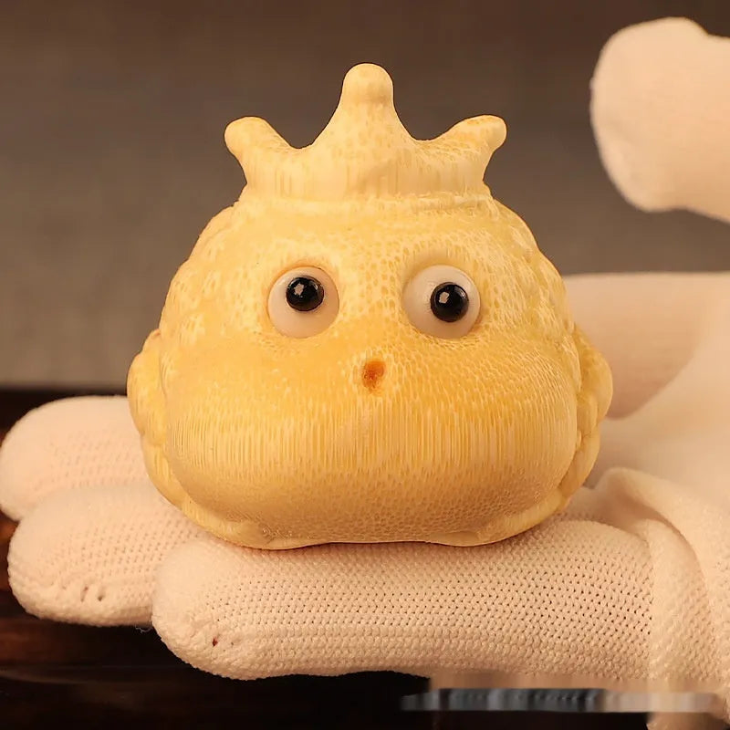 Close-up of a 5 cm cute Crown Princess Toad ornament carved from solid bamboo.