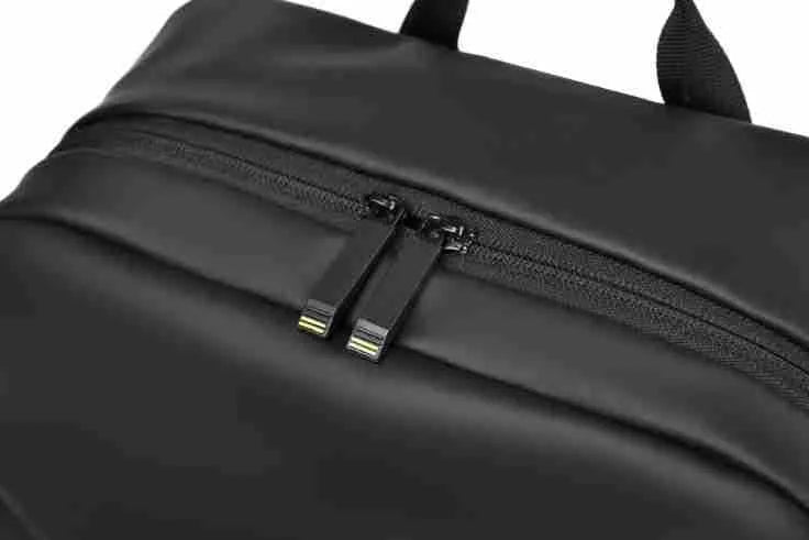 Waterproof PU leather backpack in black, blue or grey showing simple design and sewing thread detailing