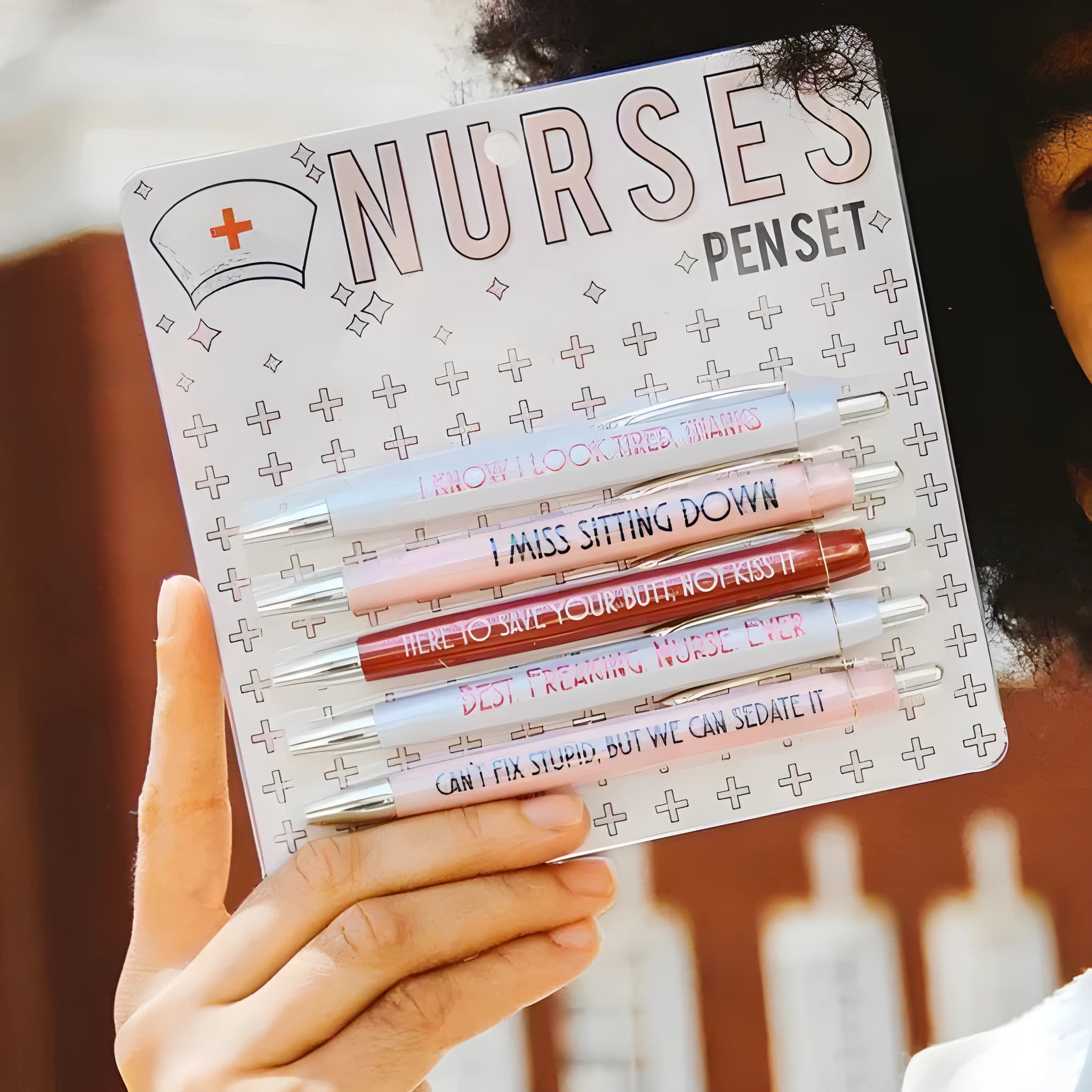 Set of five retractable ballpoint pens with funny nurse-themed graphics and copywriting.