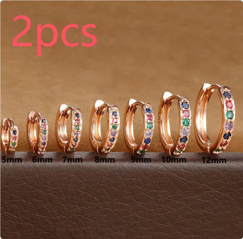 Circle perforated zircon stud earrings in gold, rose gold, and silver colour with geometric design