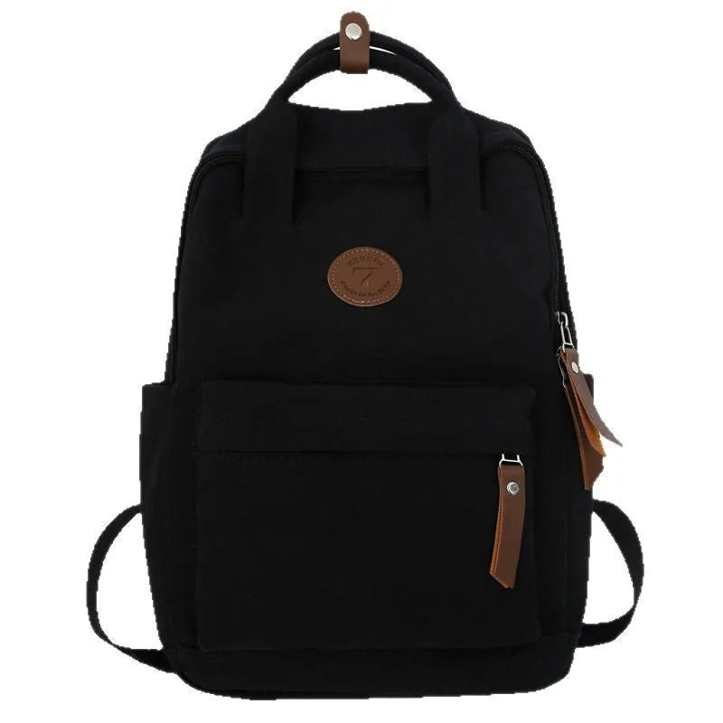 Black Oxford cloth retro-style backpack with curved shoulder straps and sewing thread details