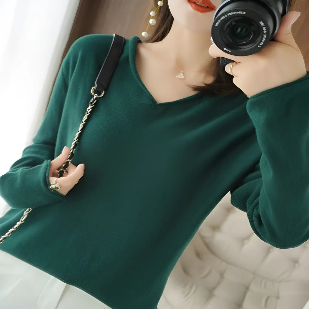 Women's long sleeve V-neck knitwear pullover top in a choice of ten colours on a hanger.