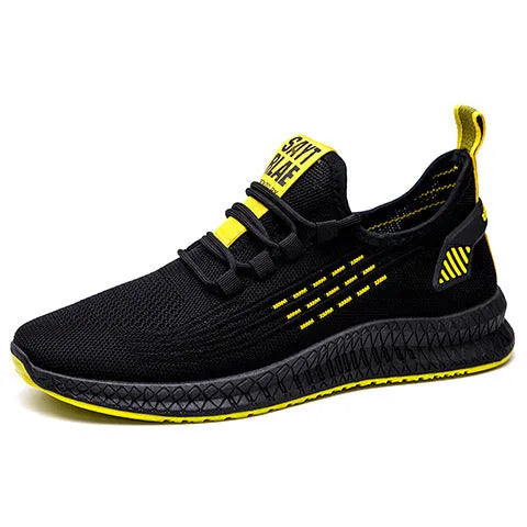 Men's black casual sports shoes with cross-strap detail and Flying Weave textured upper.