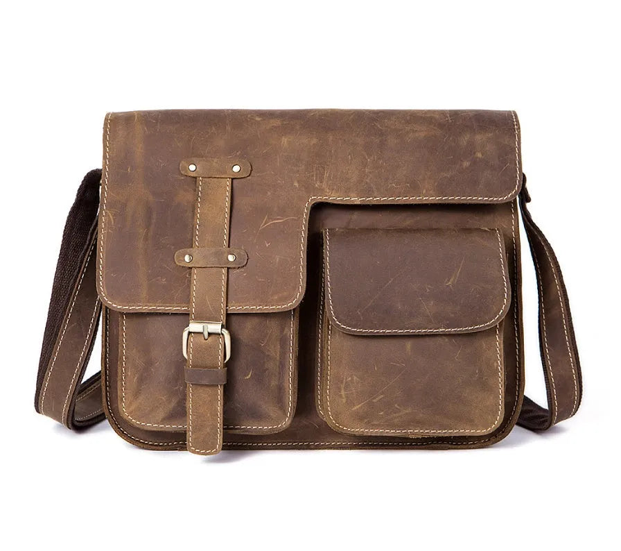 Brown leather vintage messenger bag with adjustable strap and buckle closure