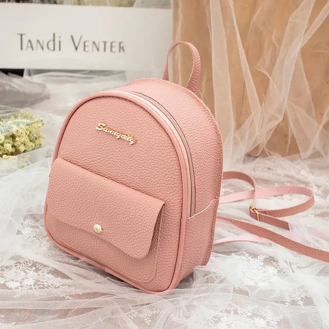 Small black PU leather women's shoulder backpack with zip, shown as a letter-style purse.