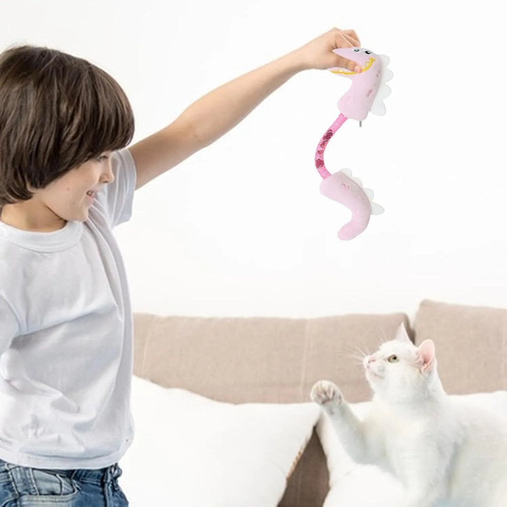 Four different cat chew toys including rope, spring, and plush kicker types in pink, purple, or yellow colours