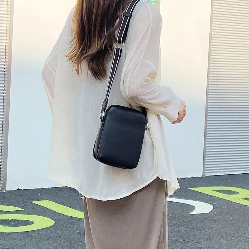 Solid colour women's crossbody phone bag in black, beige, khaki, or green.
