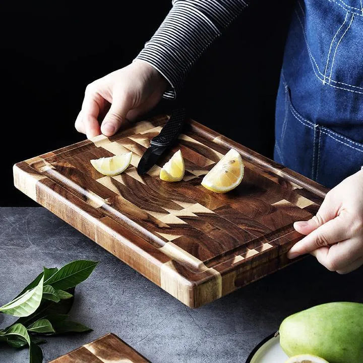 Brown imported acacia solid wood cutting board with 3cm thickness on kitchen counter