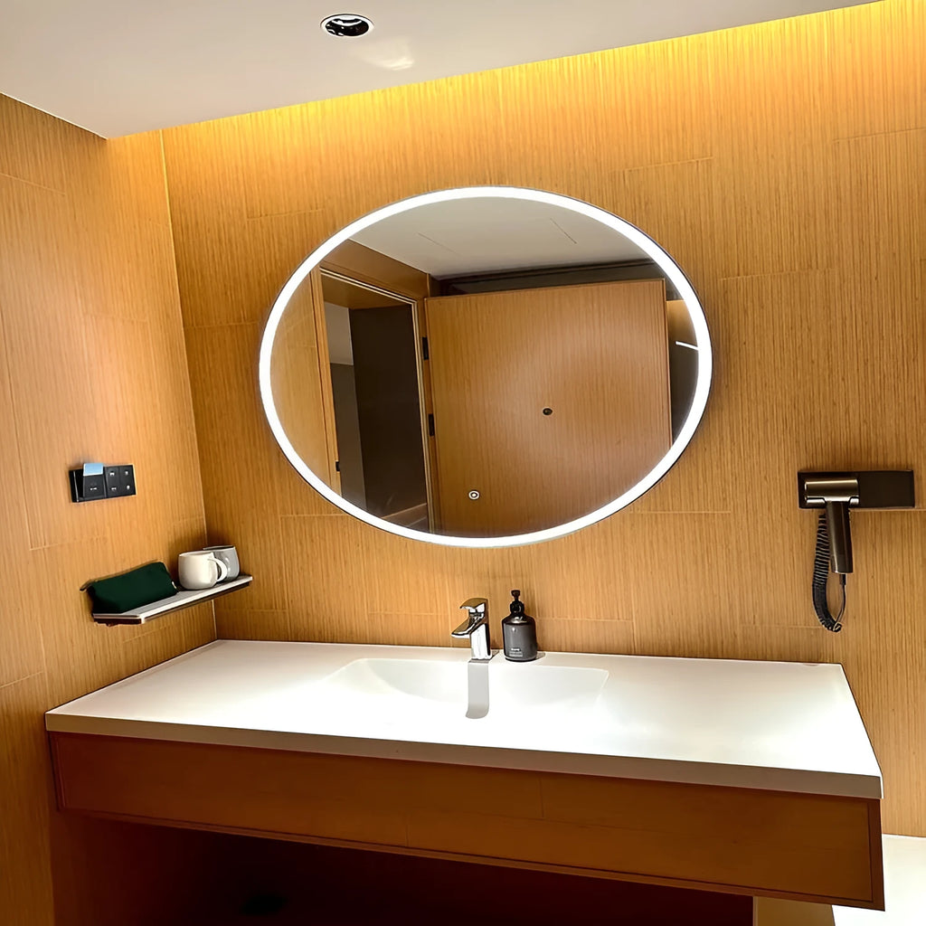 Round black aluminium frame LED smart bathroom mirror mounted on wall with illuminated surface.