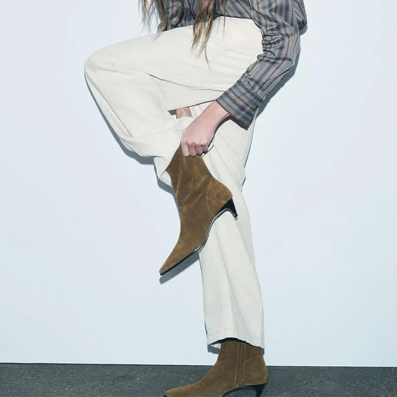Brown square toe mid calf boots with a kitten heel and side zipper on a white background.