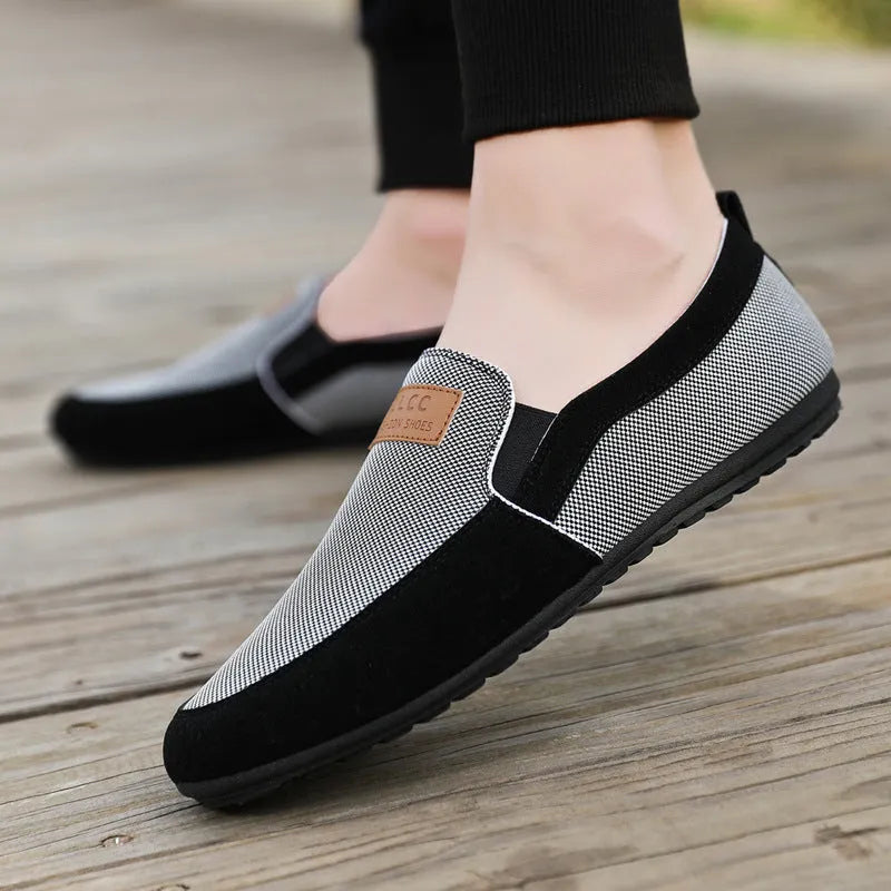Men's grey and khaki canvas casual shoes with a round toe and rubber sole.