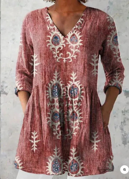 Women's printed wave pattern loose dress with wide waist and three-quarter length sleeves on a hanger.