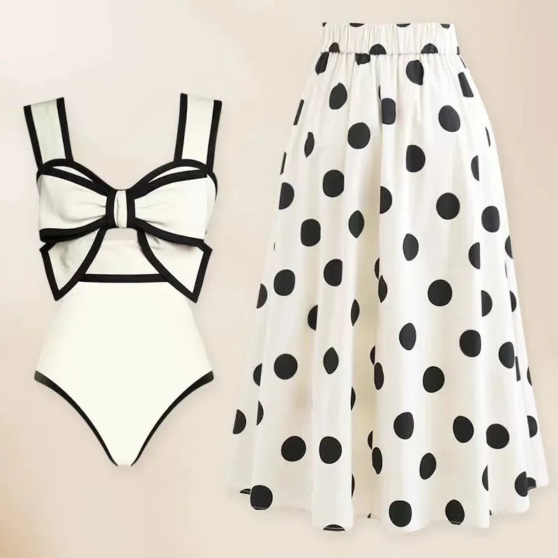 Female one-piece swim dress with round skirt and bow detail in polyester fabric