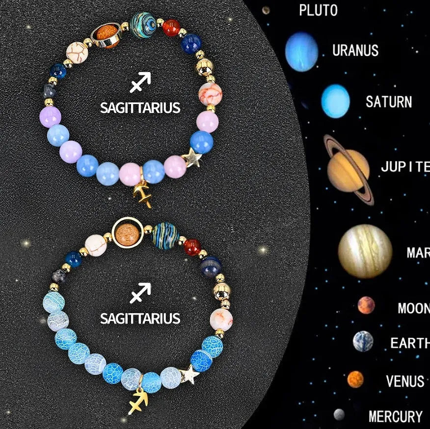 Set of two natural stone beaded bracelets with zodiac sign charms on a white background.