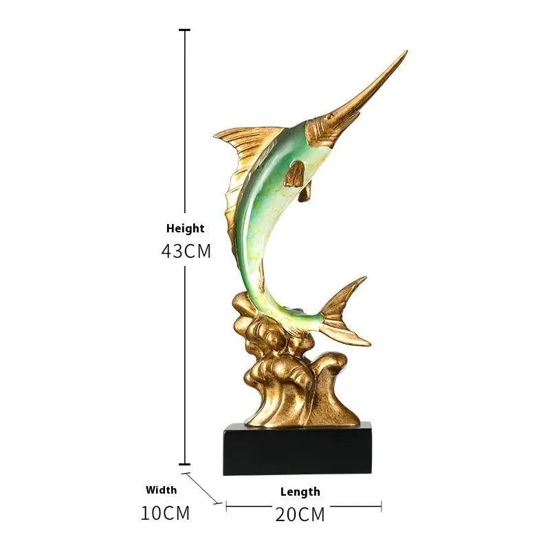 Close-up of a detailed resin European swordfish ornament in bright gold colour on a shelf.