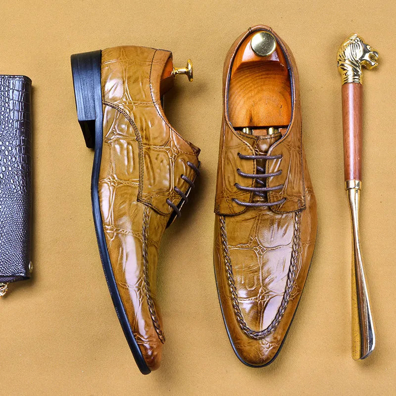 Men's brown leather loafers with a silver horse bit buckle on a rubber sole.