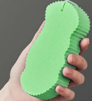 3D fish scale pattern bath sponge in white, grey, pink, or light blue colours for gentle body exfoliation