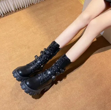 Black mid-calf women's knight boots with metal buckle and side zipper on a white background.