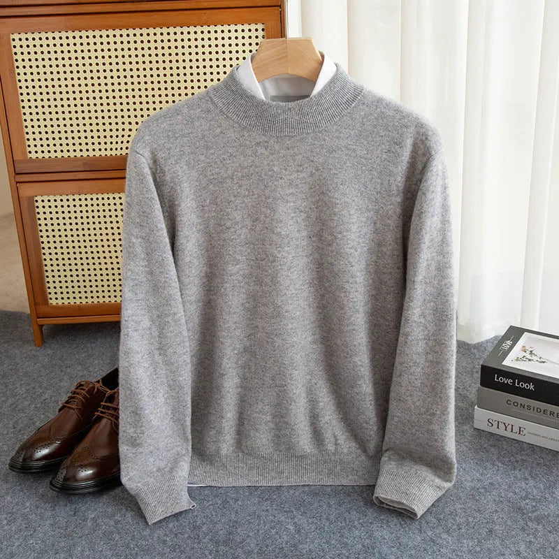 Men's loose fit half-turtleneck wool sweater in a neutral colour on a hanger.