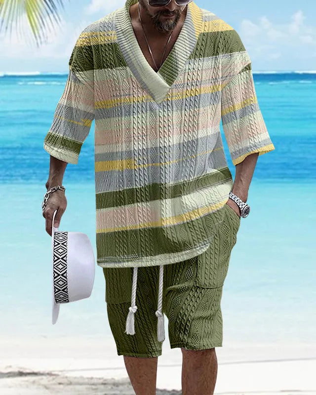 Man wearing a loose blue short sleeve top and matching casual shorts from a polyester suit set.