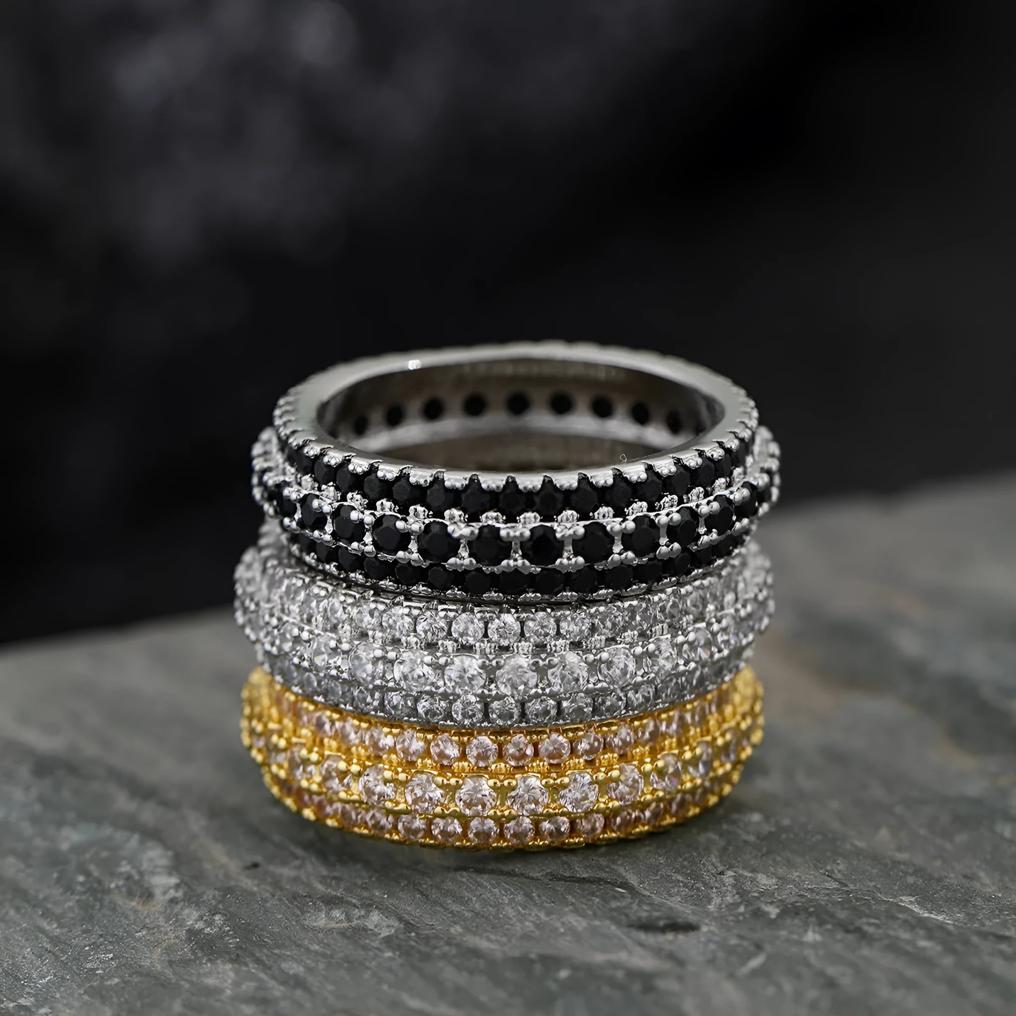 Geometric copper ring with triangular zircon stone, shown in white gold, yellow gold, and white and black finish options.