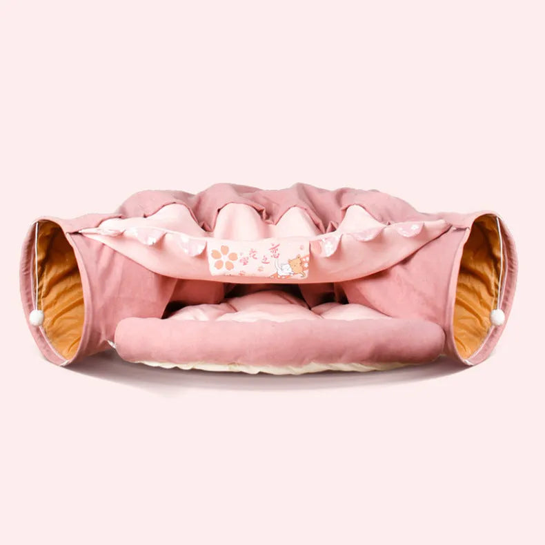 Collapsible cloth cat tunnel in Pink colour, shown extended for play.