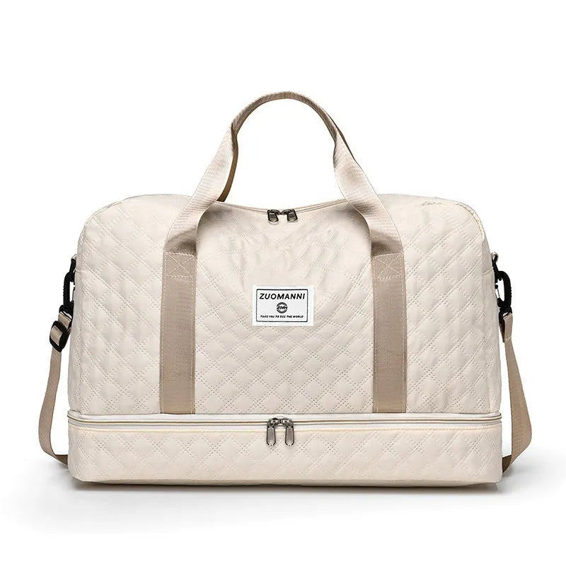 Large Oxford cloth travel bag with 36-55 litre capacity shown in haze blue colour